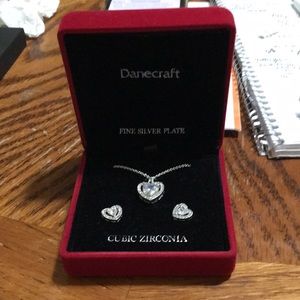 Cute necklace and earrings in a lighted box